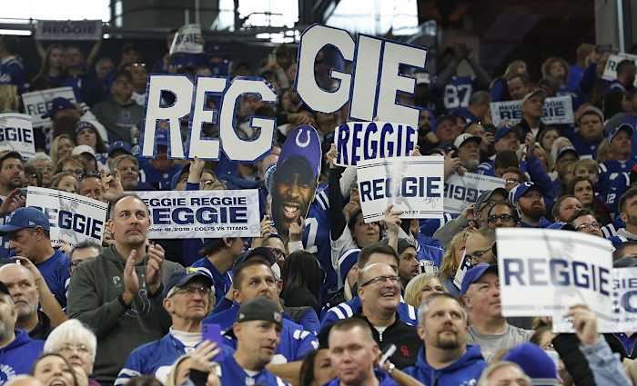 Indianapolis Colts fans salute wide receiver Reggie Wayne during his 2018 induction into the Colts Ring of Honor at Lucas Oil Stadium.